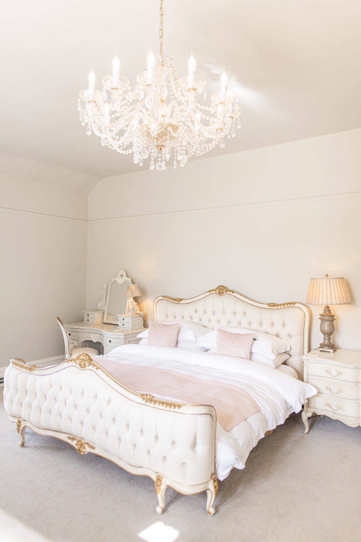 Gainsborough Suite bed beneath chandelier