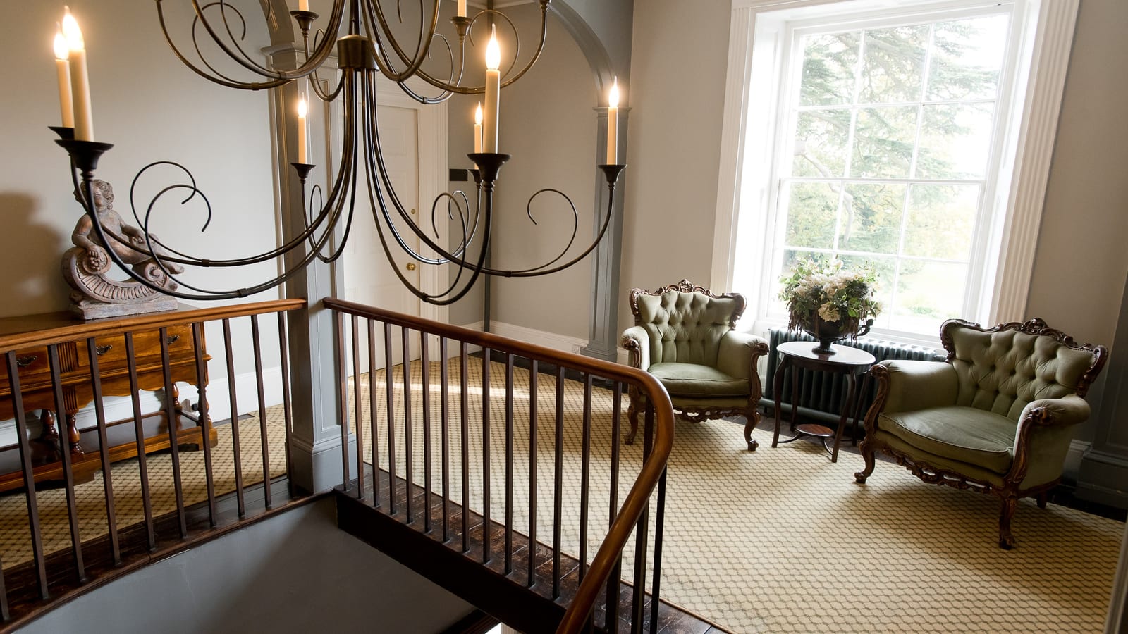 Elegant room with ornate chandelier at Glewstone Court