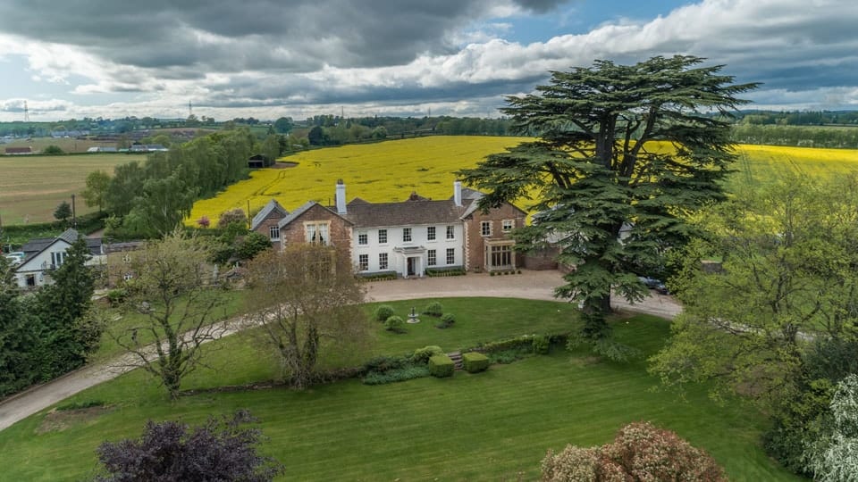 Glewstone Court country house beneath the Cedar of Lebanon